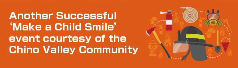 Orange banner with white text: “Another Successful 2022 ‘Make a Child Smile’ child charity event courtesy of the Chino Valley Community,” next to illustrations of firefighting equipment like a helmet, axe, hose, and extinguisher.